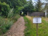2.7 km Looking back towards Goring, there is a very polite \"Keep off the grass\" notice